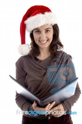 Young Woman Wearing Santa Hat Stock Photo