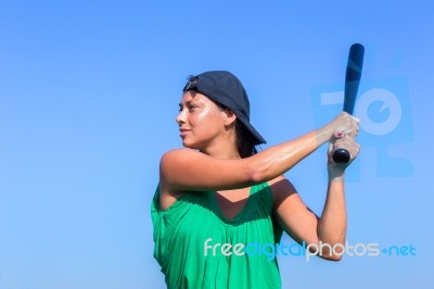 Young Woman With Baseball Bat And Cap Stock Photo