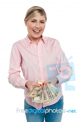 Young Woman With Dollars In Her Hands Stock Photo