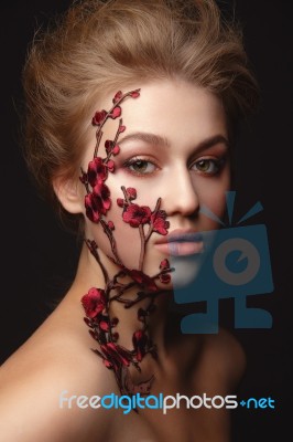 Young Woman With Flower Makeup Stock Photo