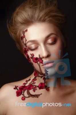 Young Woman With Flower Makeup Stock Photo