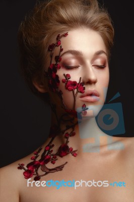 Young Woman With Flower Makeup Stock Photo