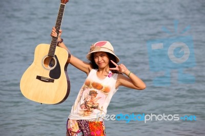 Young Woman With Guitar Stock Photo