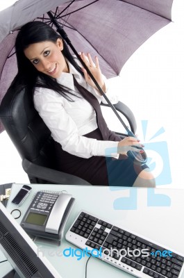 Young Woman With Umbrella And Computer Stock Photo