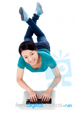 Young Woman Working With Laptop, Top View Stock Photo