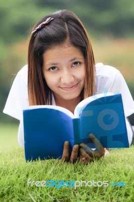 Young Women Open A Book Stock Photo