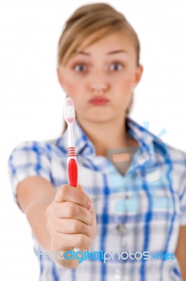 Young Women Showing The Toothbrush Stock Photo