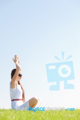 Young Women Sitting And Doing Meditating Stock Photo