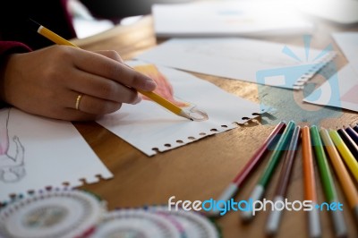 Young Women Working As Fashion Designer Drawing Sketches For Clo… Stock Photo