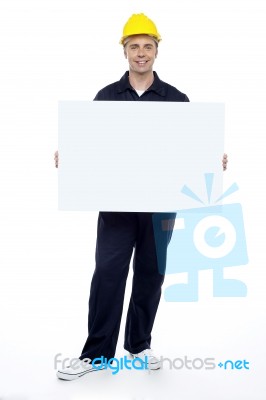 Young Worker Holding Blank Board Stock Photo