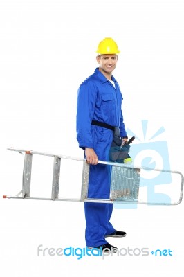 Young Worker Holding Stepladder Stock Photo