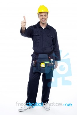 Young Worker Showing Thumbs Up Stock Photo