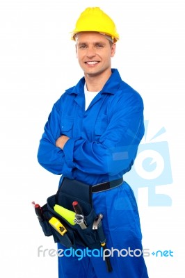 Young Worker With Arms Crossed Stock Photo