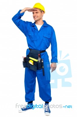 Young Worker With Hand Shading Stock Photo