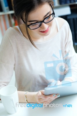 Young Worker Woman With Digital Tablet In Her Office Stock Photo