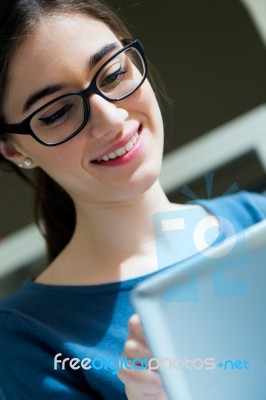 Young Worker Woman With Digital Tablet In Her Office Stock Photo