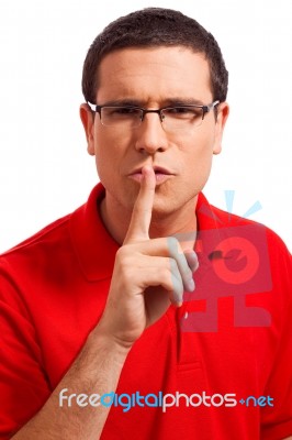 Younger Man Showing Silence Symbol Stock Photo