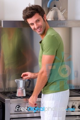 Youngman Preparing Coffee Stock Photo