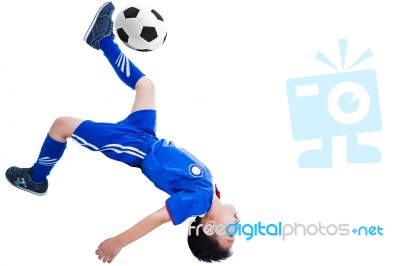 Youth Soccer Player Kicking The Ball Stock Photo