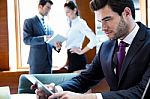 A Business Team Of Three In Office And Planning Work Stock Photo