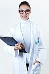 A Female Doctor With A Folder Stock Photo