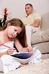 A Girl Doing Homework Stock Photo