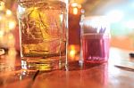 A Glass Of Whiskey On The Table Stock Photo