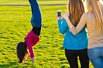 A Group Of Friends Taking Photos With A Smartphone Stock Photo