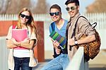 A Group Of Friends Talking In The Street After Class Stock Photo