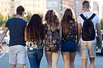 A Group Of Friends Talking In The Street After Class Stock Photo