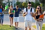 A Group Of Friends Talking In The Street After Class Stock Photo