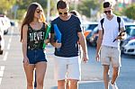 A Group Of Friends Talking In The Street After Class Stock Photo