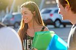 A Group Of Friends Talking In The Street After Class Stock Photo