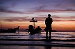 A Man Seeing The Beautiful Twilight Sunset Sky Stock Photo