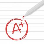 A Plus Grade On Line Paper With Red Pen Stock Photo