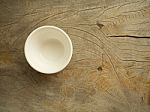 A Small Cup Put Onto A Wooden Stock Photo