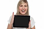 Active Caucasian Girl Displaying Tablet Device Stock Photo