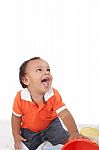 Adorable 1 Year Old Hispanic Boy With A Big Smile Looking Up Stock Photo