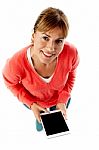 Aerial Shot Of A Lady Using Tablet Pc Stock Photo