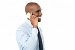 African Male Is Using Cell Phone Stock Photo