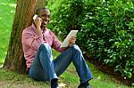 African Man With Smart Phone And Tablet Stock Photo