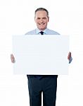 aged Businessman with empty sign Stock Photo