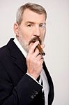 Aged Man Smoking Cigar Over White Stock Photo