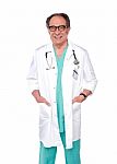 Aged Surgeon With Hand In Pocket Stock Photo