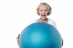 Aged Woman Posing With Exercise Ball Stock Photo