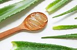 Aloe Vera Fresh Leaves With Aloe Vera Gel On Wooden Spoon Stock Photo