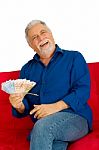 An Old Man Holding Money Stock Photo