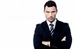 Angry Businessman With Crossed Arms Stock Photo