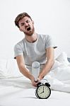 Angry Man Hand Holding Baseball Bat Smashing Alarm Clock Stock Photo