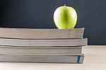 Apple On Books Stock Photo